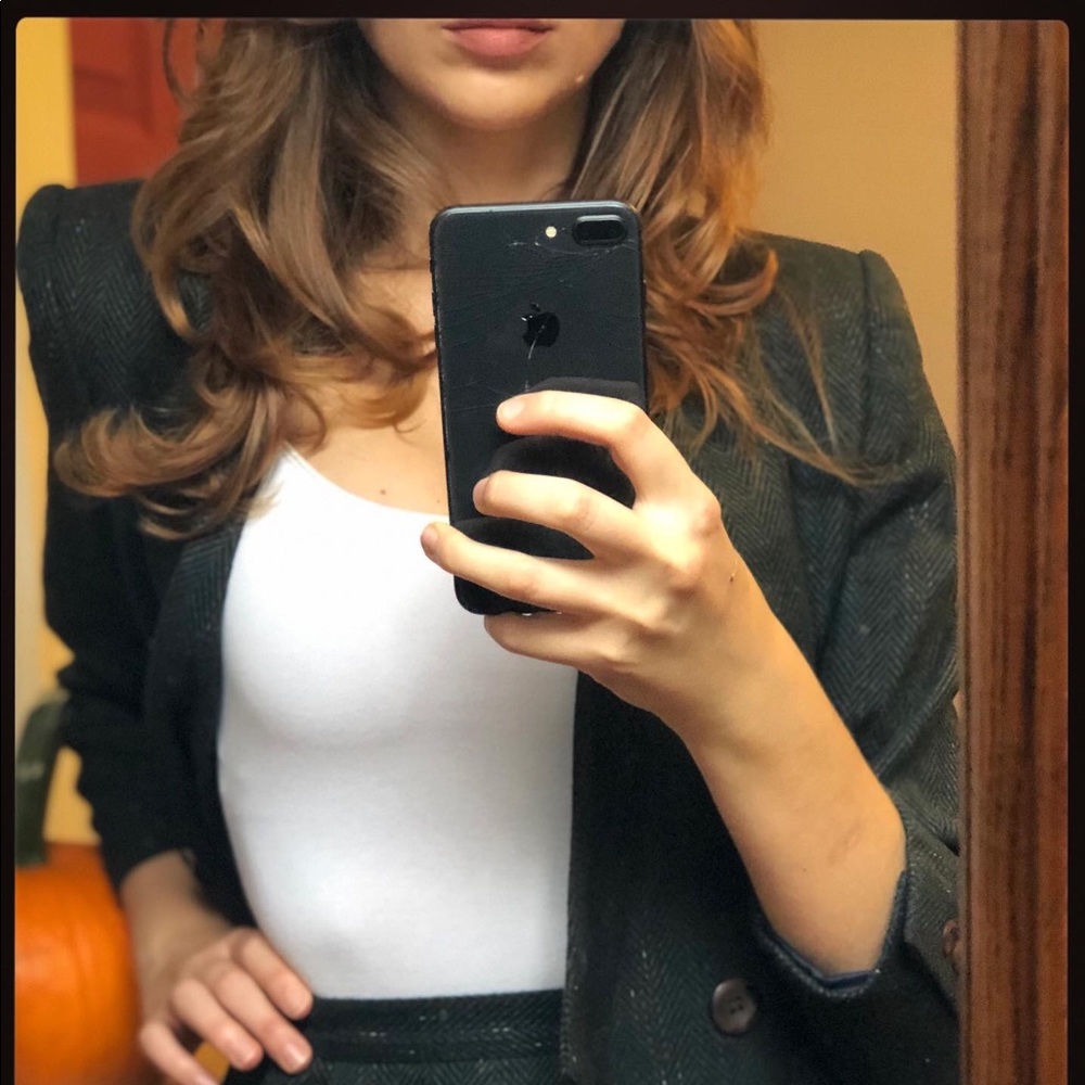 Women's winter skirt suit with padded shoulders.